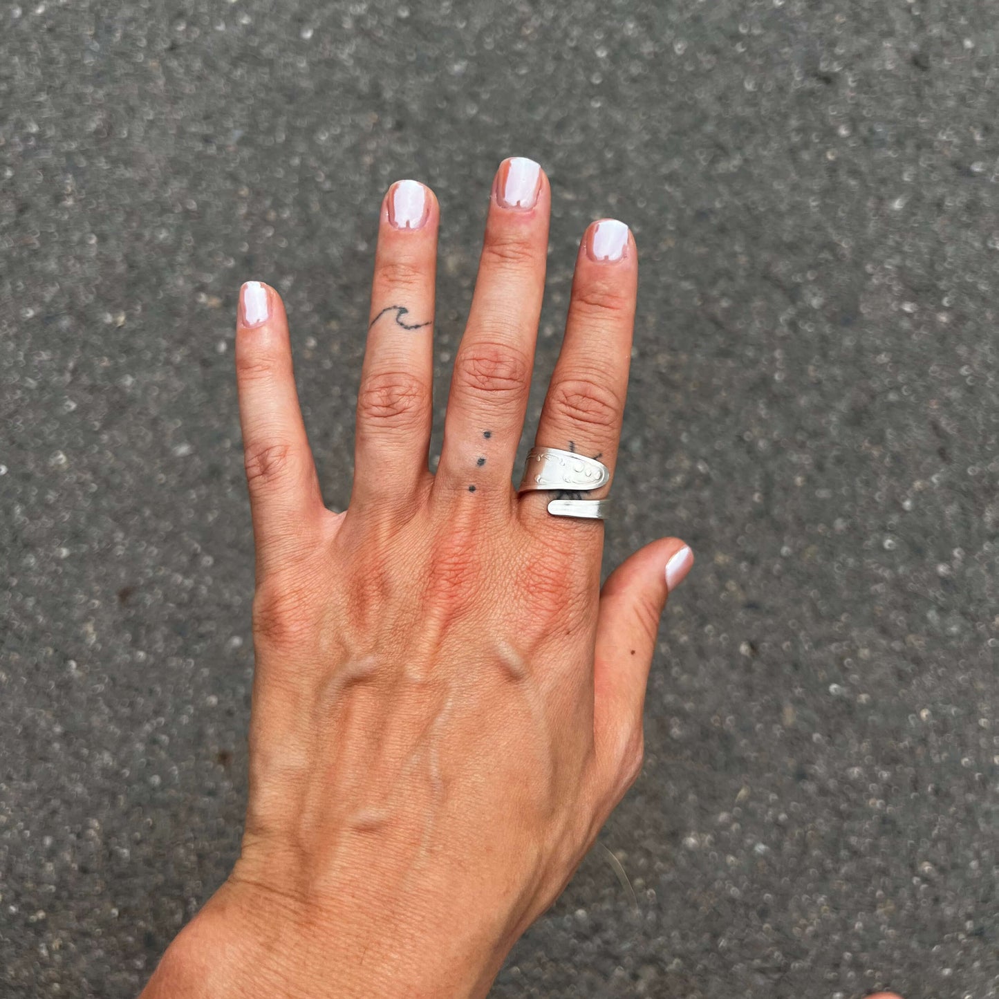 hand wearing ring