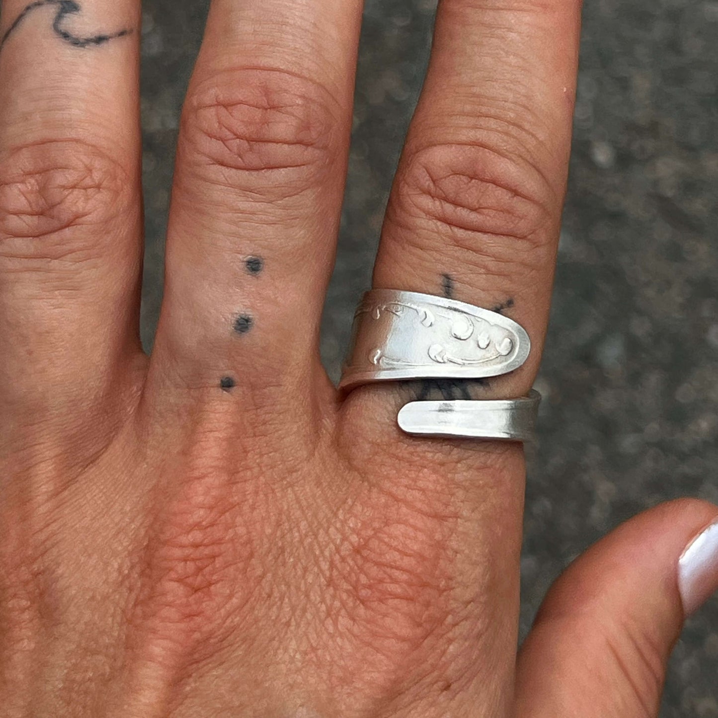 hand wearing ring