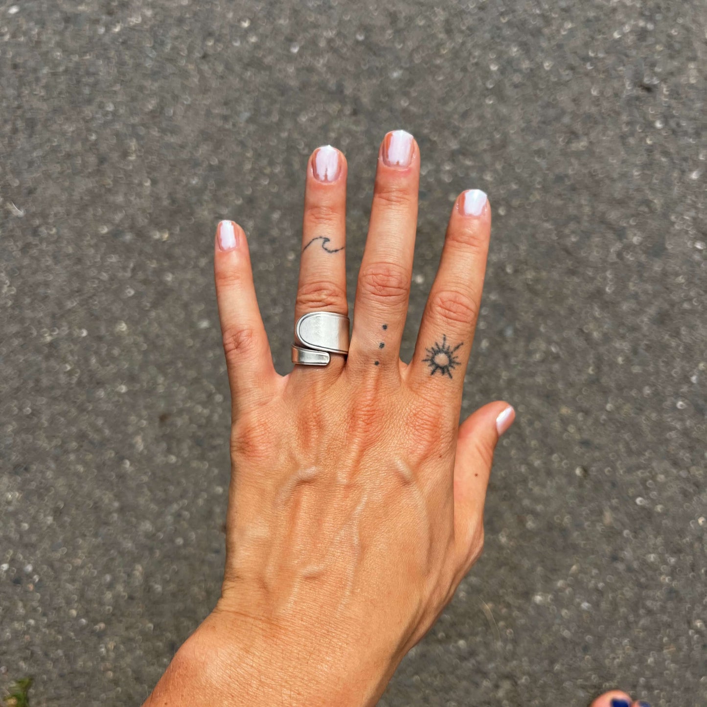 handcrafted silver spoon ring made from antique cutlery on hand