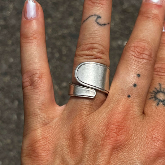 handcrafted silver spoon ring made from antique cutlery on hand
