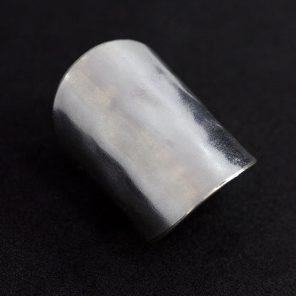 Silver ring on a black background
