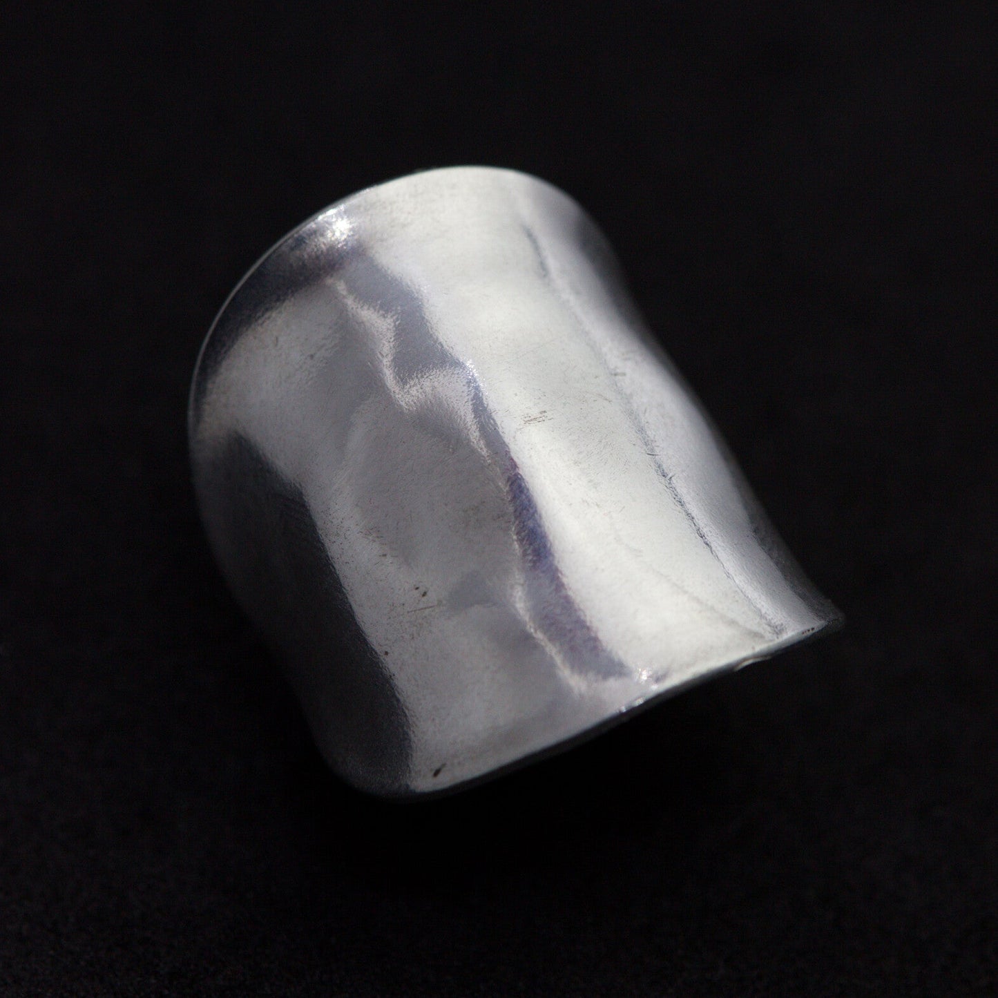 Silver ring on a black background