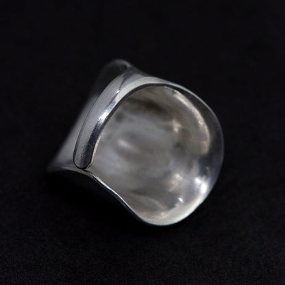 Silver ring on a black background